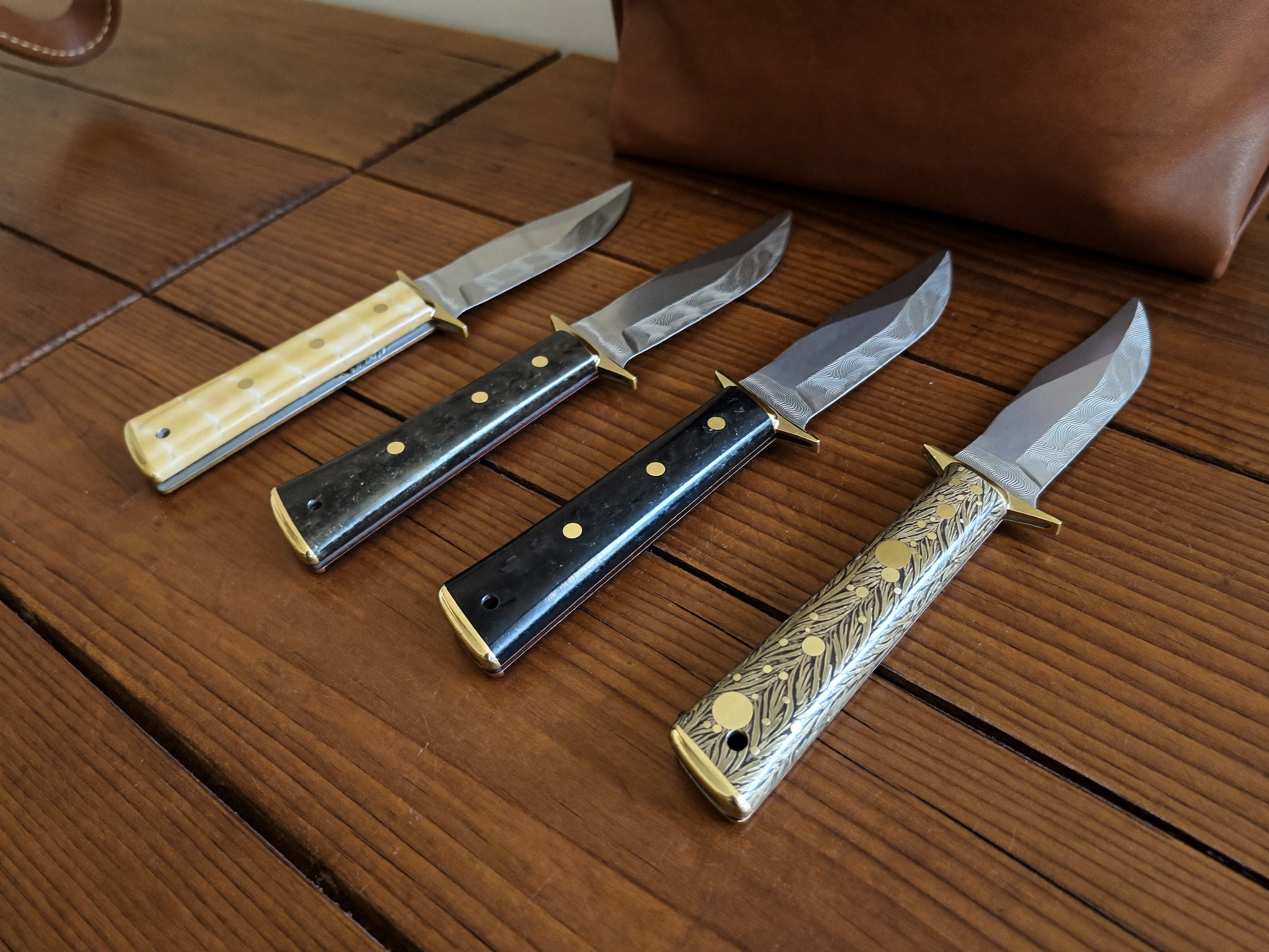 Damascus hunting and folding knives pictured for the field knife guide